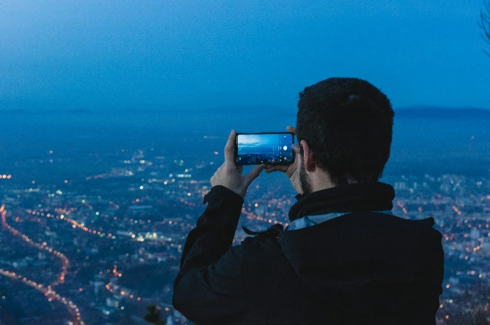 man holding Android smartphone